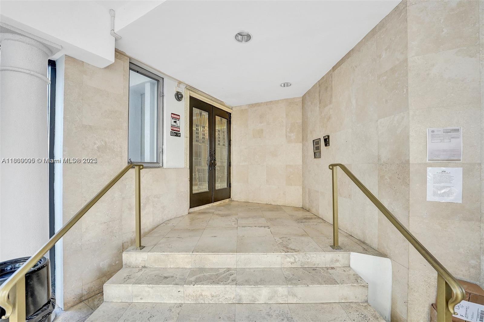 9195 Collins Avenue, Unit 304 Surfside, FL 33154 - Photo 23 of 32 a view of an entryway