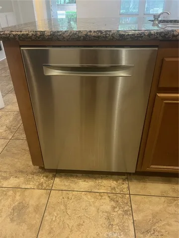 a stove top oven sitting inside of a kitchen