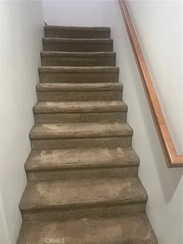 a view of a refrigerator in a bathroom