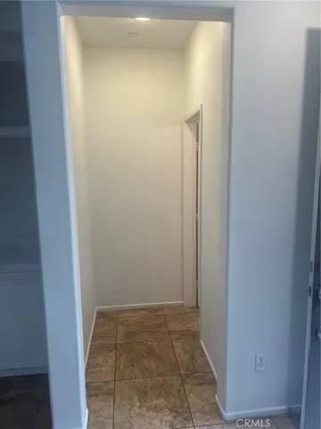 a white toilet sitting next to a bathroom sink and vanity