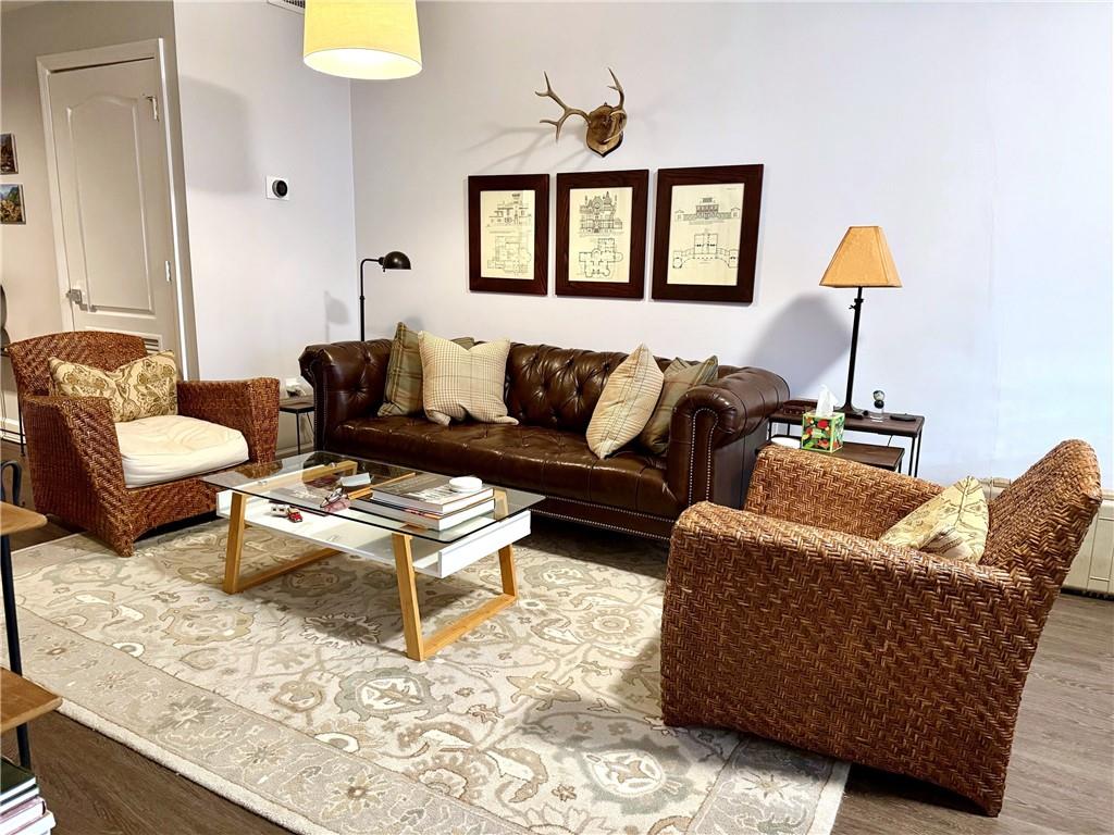 195 14th Street Northeast, Unit 312 Atlanta, GA 30309 - Photo 12 of 33 a living room with furniture and a window
