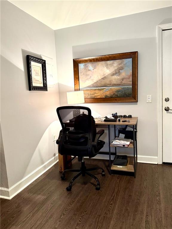 195 14th Street Northeast, Unit 312 Atlanta, GA 30309 - Photo 14 of 33 a room with chair and wooden floor