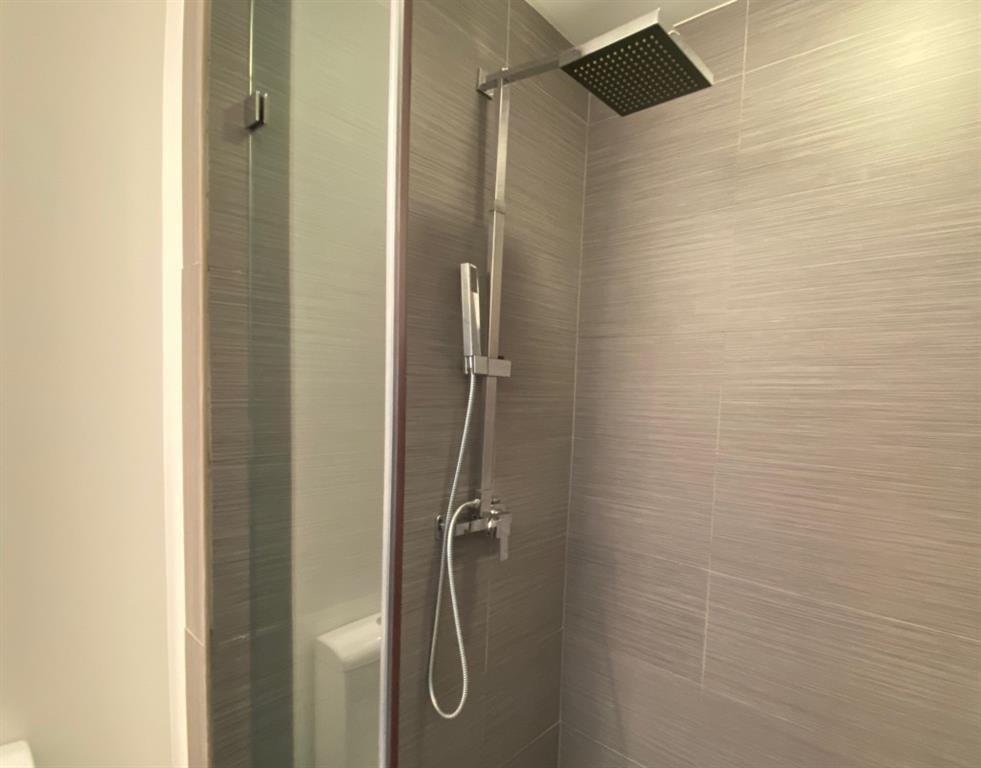 195 14th Street Northeast, Unit 312 Atlanta, GA 30309 - Photo 23 of 33 a bathroom with a shower