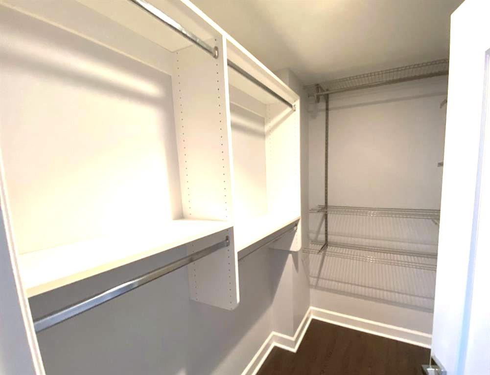 195 14th Street Northeast, Unit 312 Atlanta, GA 30309 - Photo 31 of 33 a view of walk in closet with empty racks