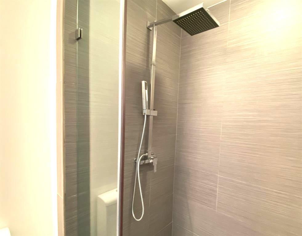 195 14th Street Northeast, Unit 312 Atlanta, GA 30309 - Photo 33 of 33 a bathroom with a shower