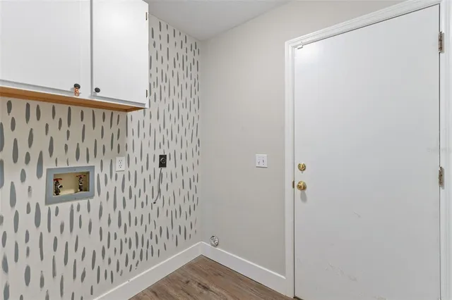 an aerial view of residential houses with outdoor space and swimming pool