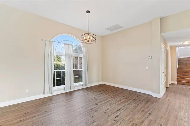 a kitchen that has a sink and a stove top oven