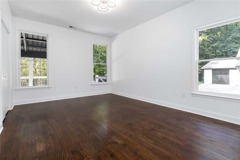 1217 Cabin Bridge Road Bethlehem, GA 30620 - Photo 39 of 43 a view of an empty room with wooden floor and a window