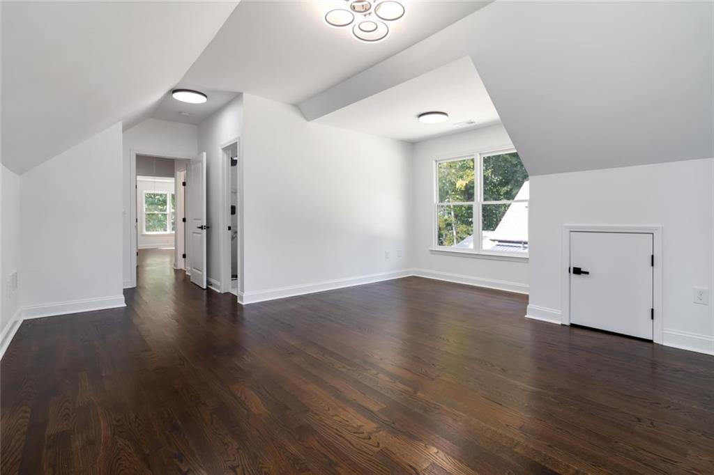 1217 Cabin Bridge Road Bethlehem, GA 30620 - Photo 41 of 43 an empty room with wooden floor and windows