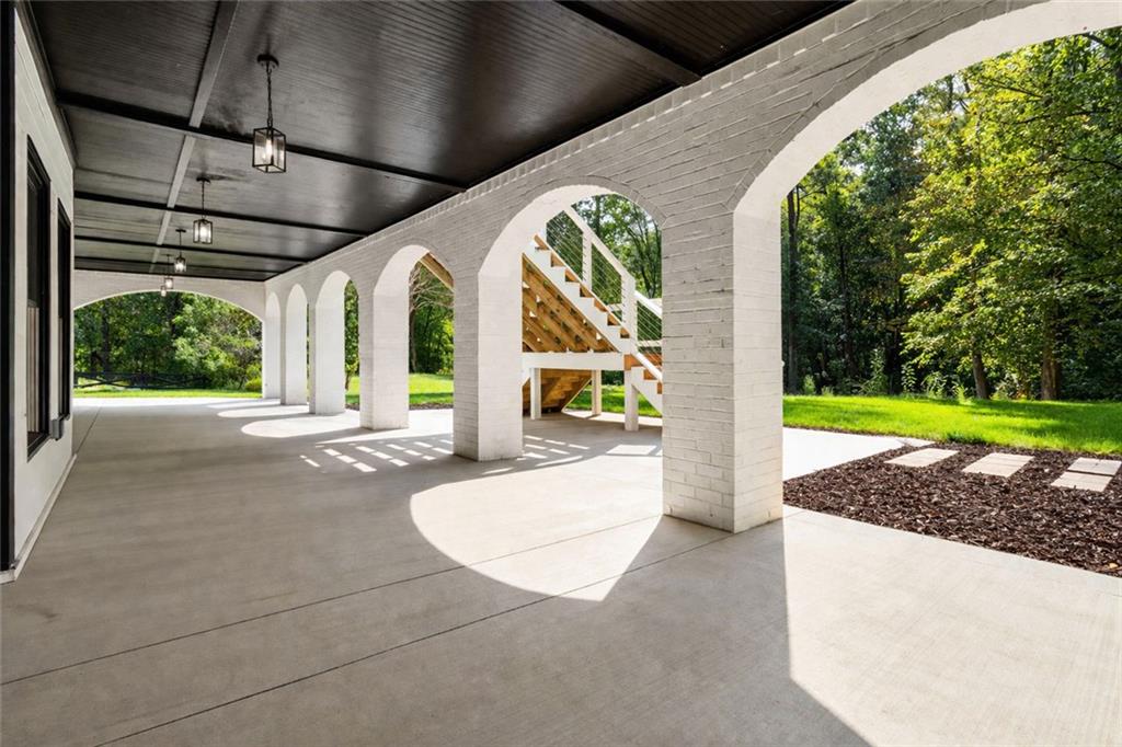 1217 Cabin Bridge Road Bethlehem, GA 30620 - Photo 10 of 43 a view of a swimming pool with a porch