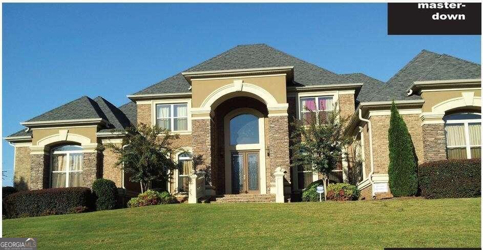 1813 Trinidad Stockbridge, GA 30281 - Photo 5 of 12 a front view of a house with a yard