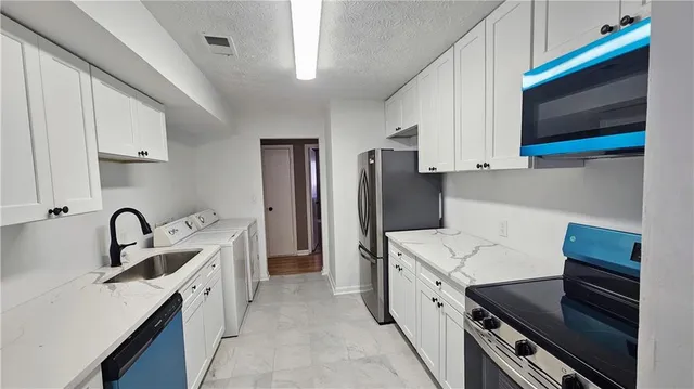 a bathroom with a sink a toilet and a bathtub