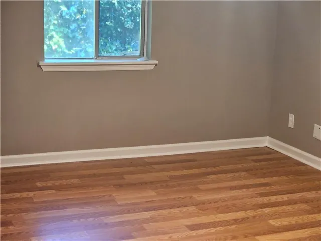 a view of a room with a ceiling fan