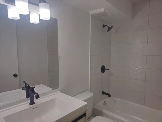 a view of a kitchen with sink and washer