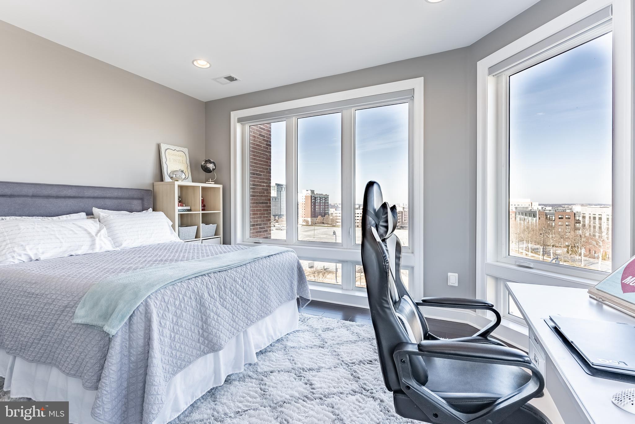 500 Riversail Lane, Unit 438 Oxon Hill, MD 20745 - Photo 18 of 54 a bedroom with a bed and a wooden floor