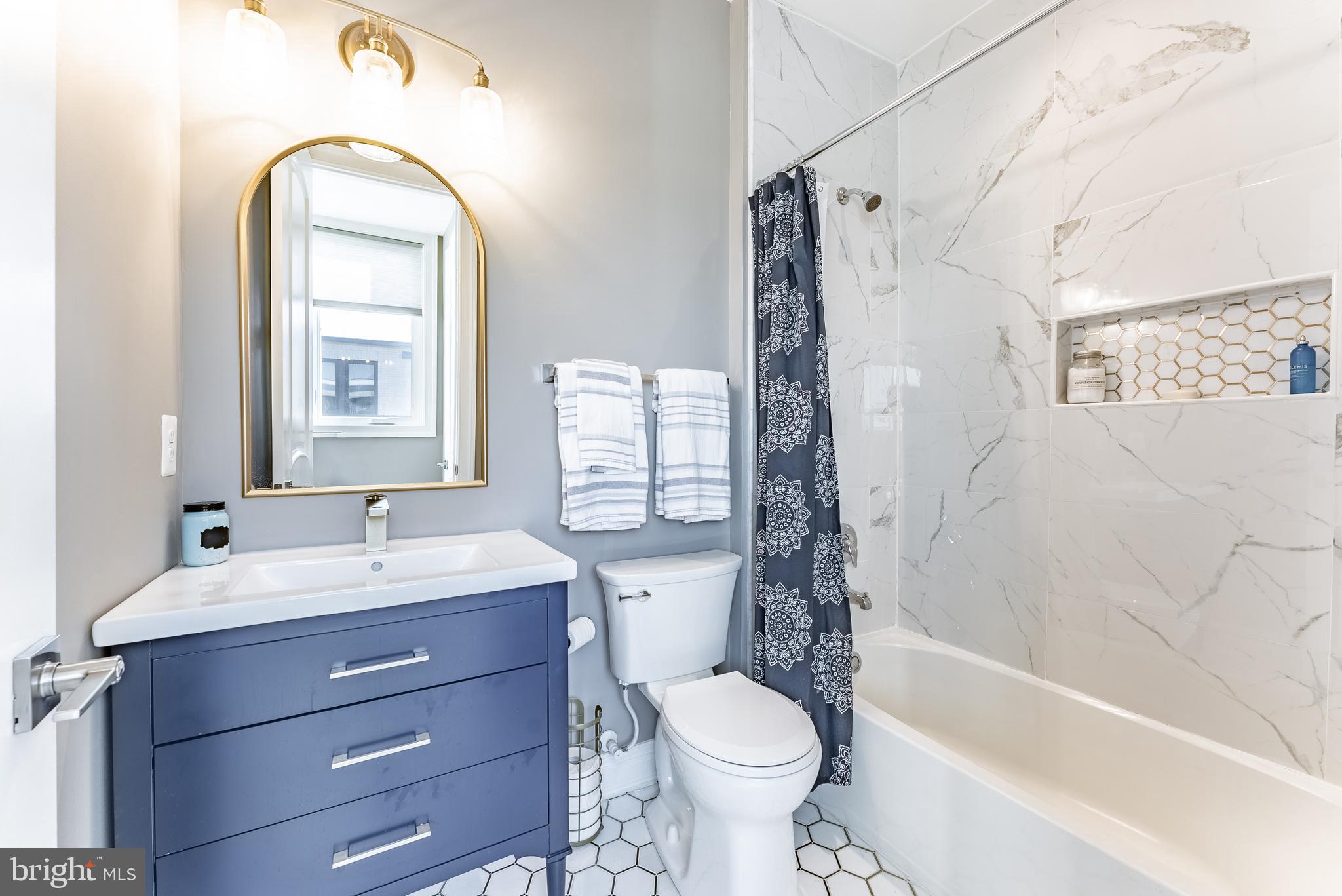 500 Riversail Lane, Unit 438 Oxon Hill, MD 20745 - Photo 23 of 54 a bathroom with a sink toilet and shower