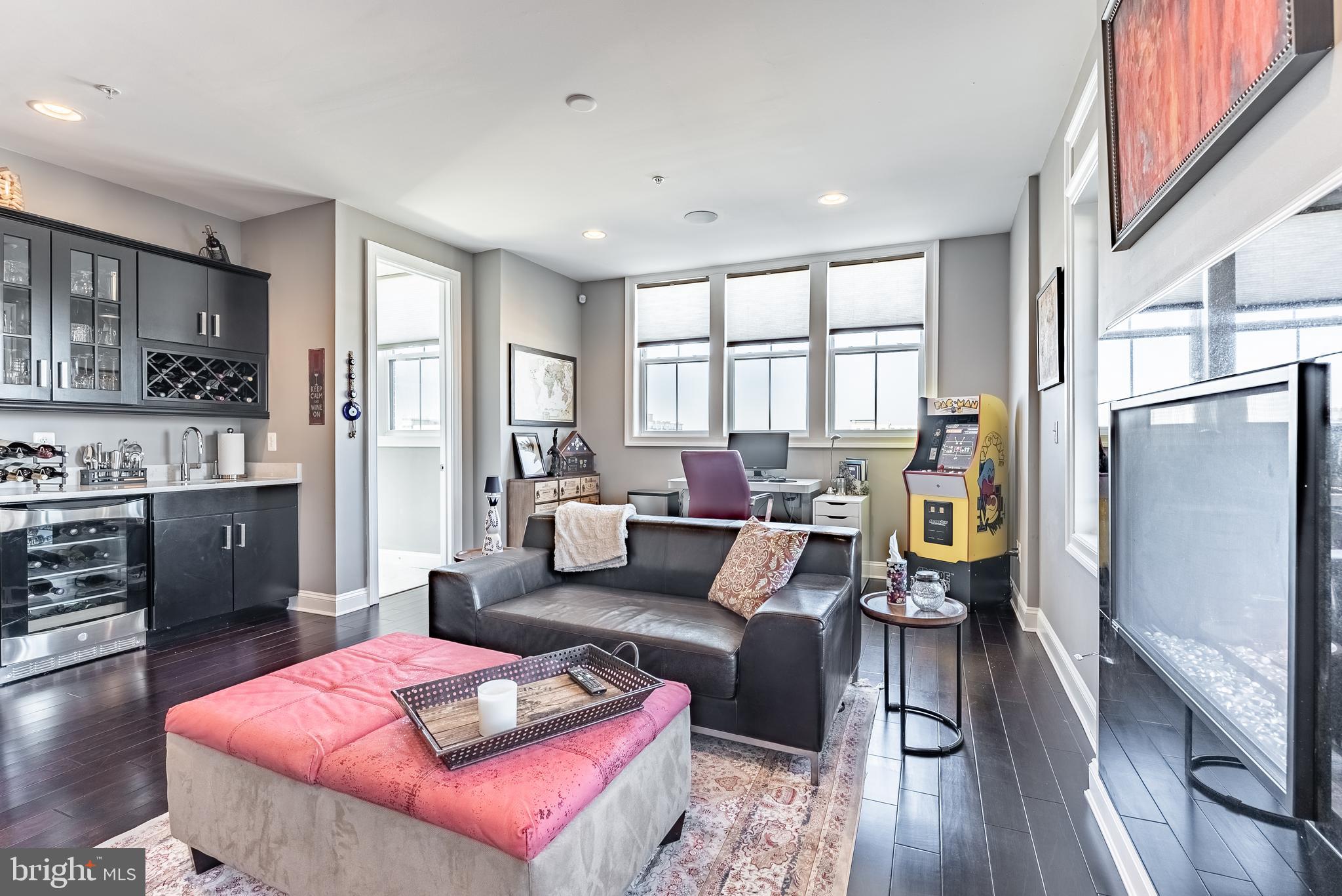 500 Riversail Lane, Unit 438 Oxon Hill, MD 20745 - Photo 27 of 54 a living room with furniture wooden floor and a large window