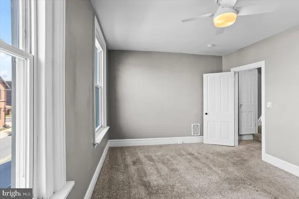 a view of an empty room and window