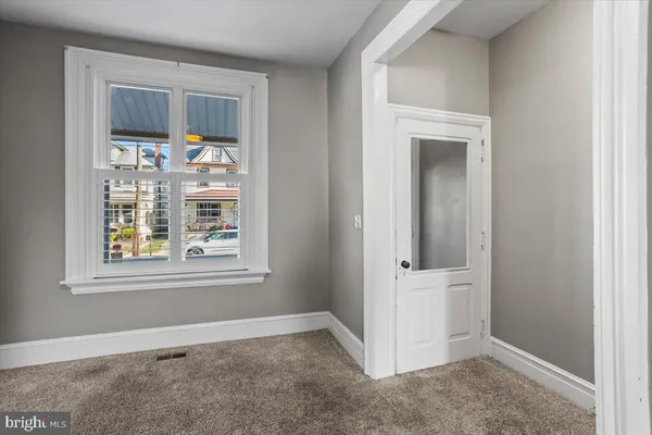 an empty room that has a window