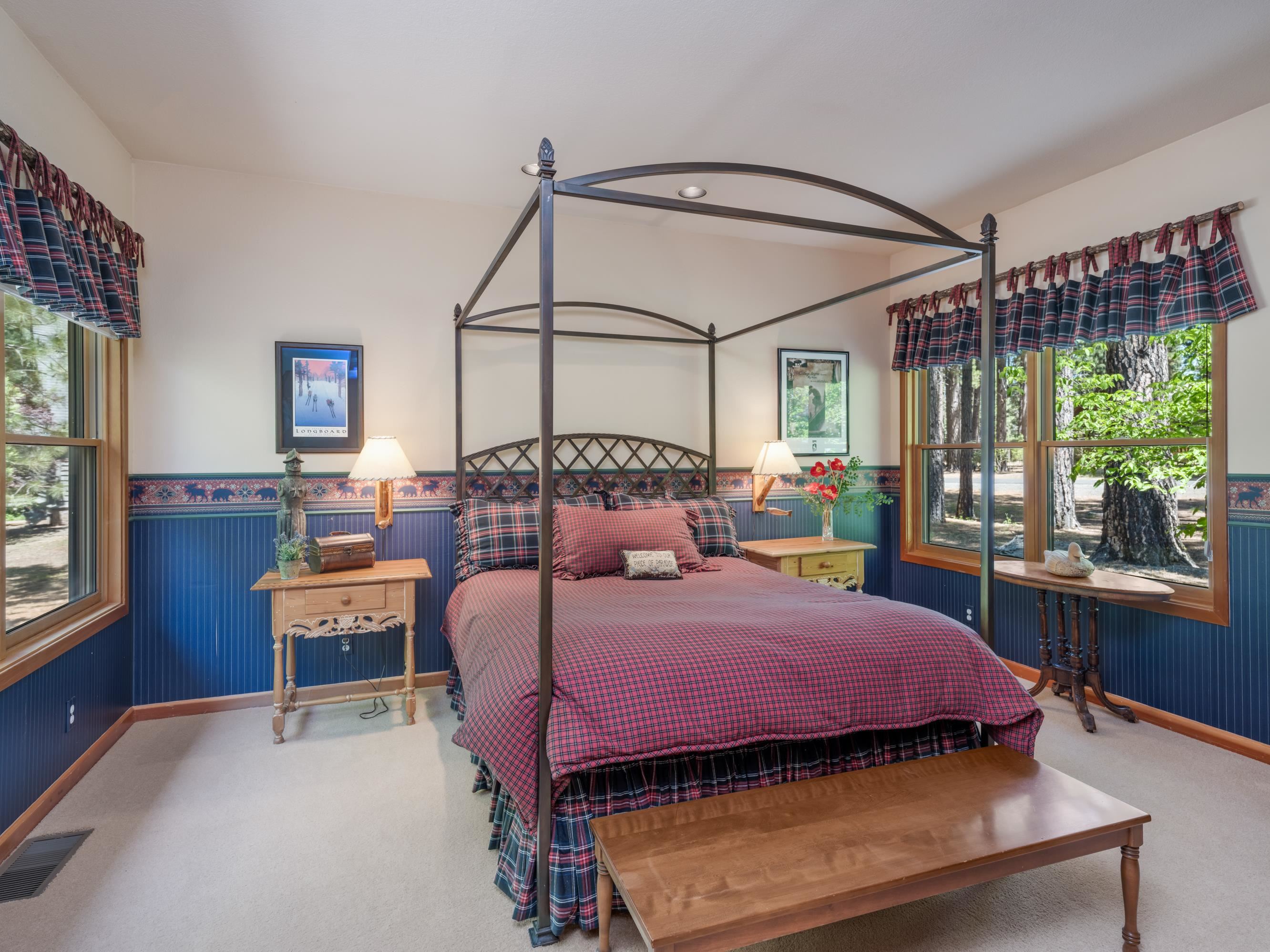 134 Quail View Circle Clio, CA 96106 - Photo 21 of 49 a bedroom with a bed a table and chair