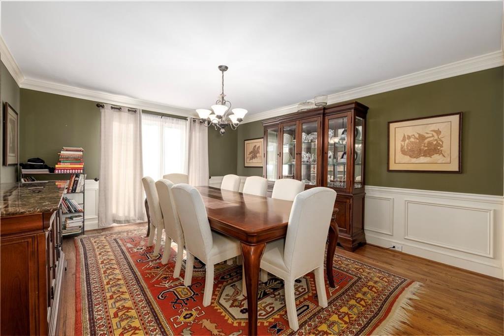 2010 Carrington Court Smoke Rise, GA 30087 - Photo 12 of 56 a view of a dining room with furniture window and wooden floor