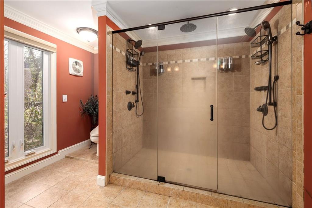 2010 Carrington Court Smoke Rise, GA 30087 - Photo 20 of 56 a bathroom with a glass shower door