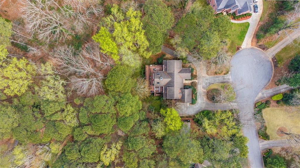 2010 Carrington Court Smoke Rise, GA 30087 - Photo 2 of 56 an aerial view of residential house with outdoor space and trees all around