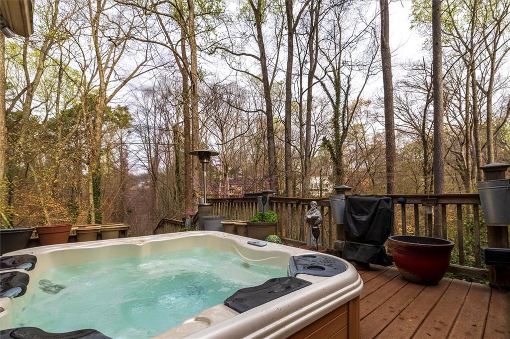 2010 Carrington Court Smoke Rise, GA 30087 - Photo 21 of 56 a view of swimming pool with chairs and wooden fence