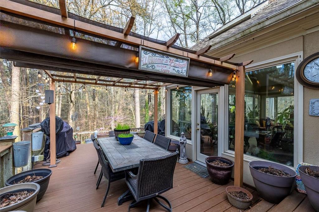 2010 Carrington Court Smoke Rise, GA 30087 - Photo 22 of 56 a view of a porch with furniture and wooden floor