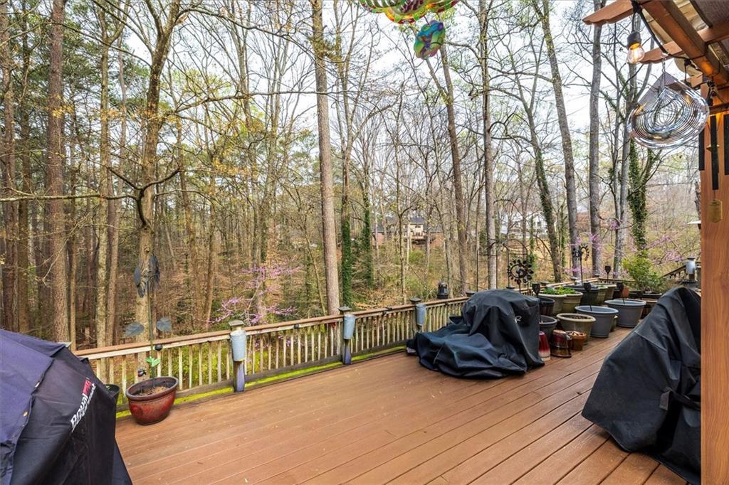 2010 Carrington Court Smoke Rise, GA 30087 - Photo 26 of 56 a view of a balcony with couch and wooden floor