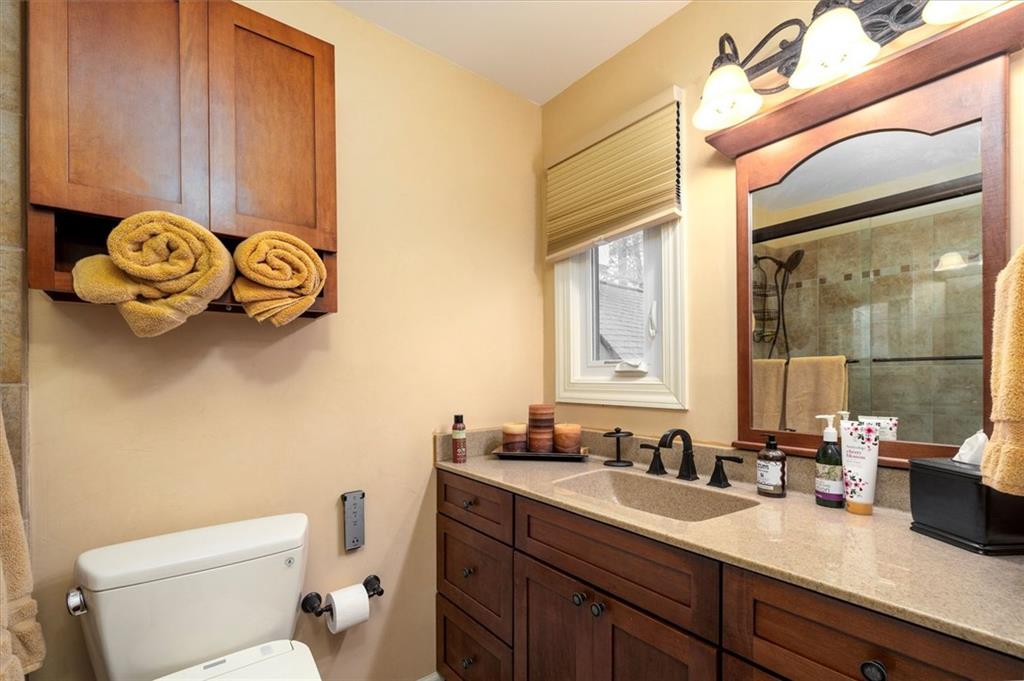 2010 Carrington Court Smoke Rise, GA 30087 - Photo 34 of 56 a bathroom with a sink a toilet and a mirror