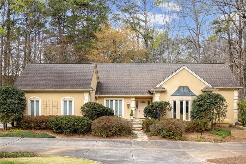 2010 Carrington Court Smoke Rise, GA 30087 - Photo 4 of 56 front view of a house with a yard