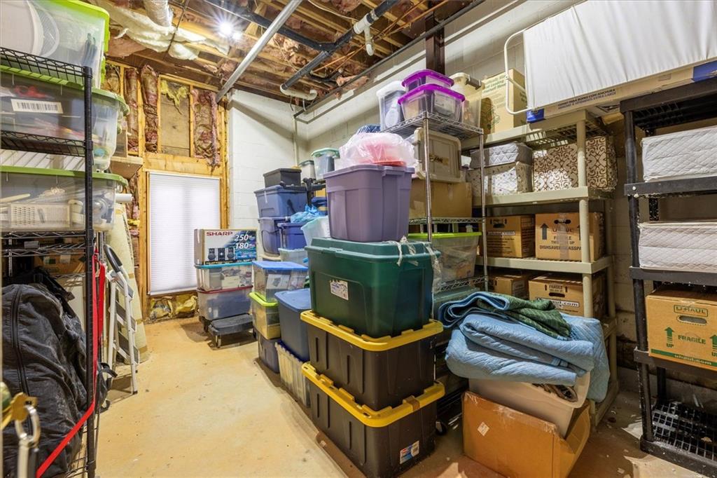 2010 Carrington Court Smoke Rise, GA 30087 - Photo 44 of 56 a living room with furniture and a fireplace