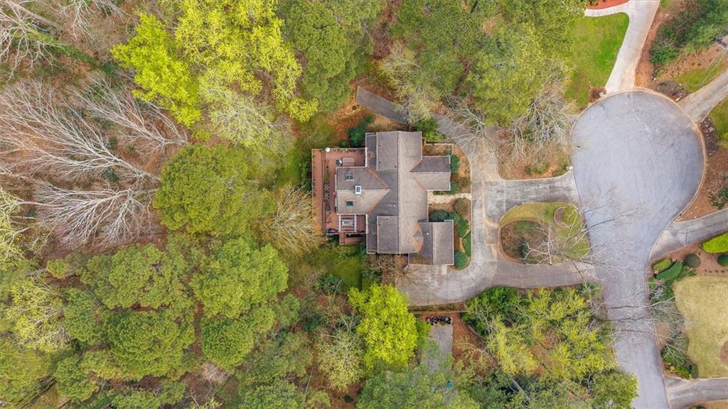 2010 Carrington Court Smoke Rise, GA 30087 - Photo 48 of 56 an aerial view of residential houses with outdoor space and trees