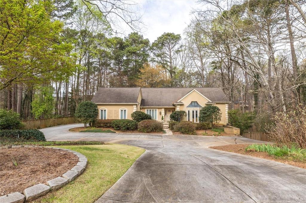 2010 Carrington Court Smoke Rise, GA 30087 - Photo 52 of 56 front view of a house with a yard