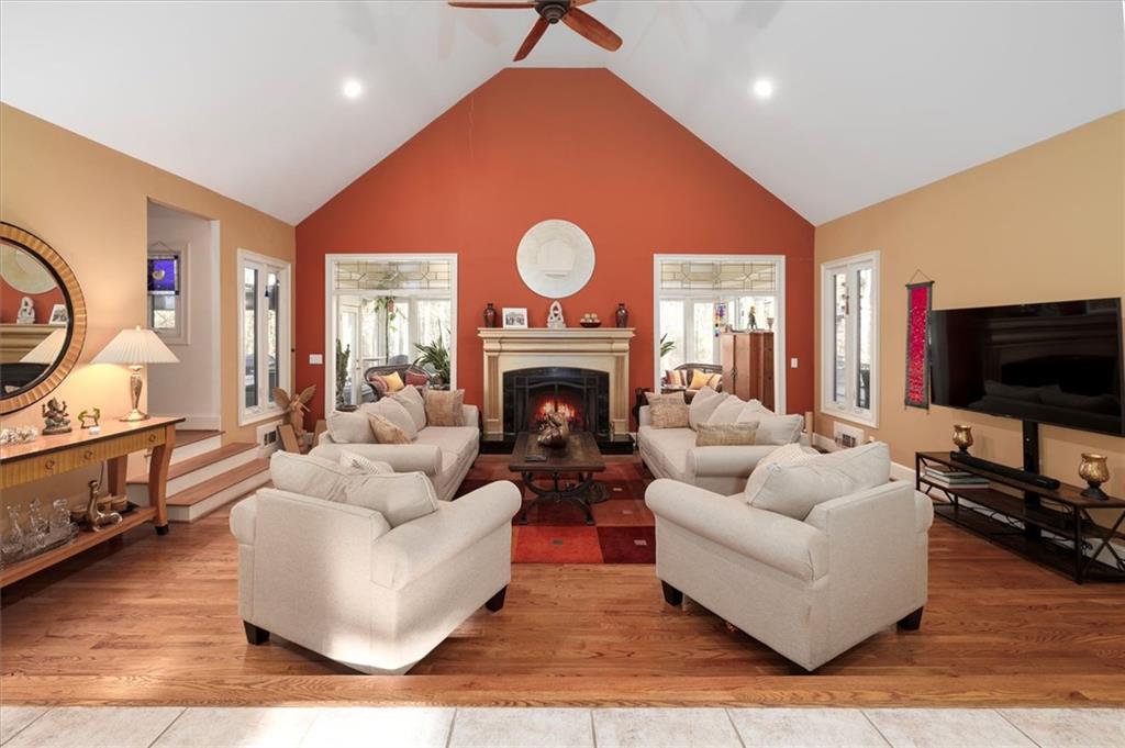 2010 Carrington Court Smoke Rise, GA 30087 - Photo 7 of 56 a living room with furniture a fireplace and a flat screen tv