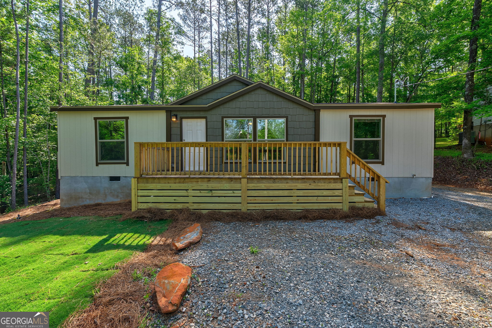 128 Sunfish Trail Southwest Eatonton, GA 31024 - Photo 1 of 48 a view of a house with a yard