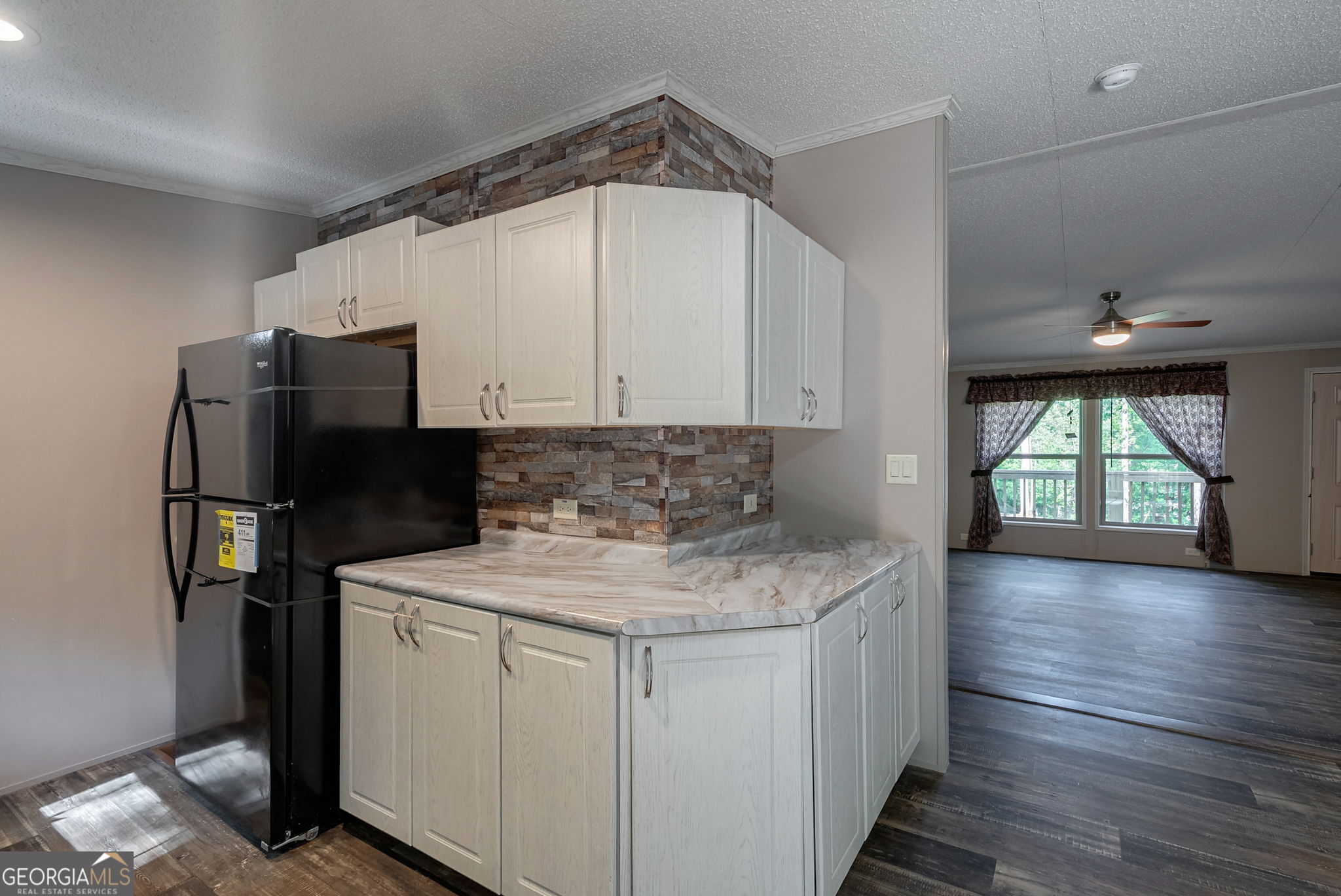 128 Sunfish Trail Southwest Eatonton, GA 31024 - Photo 16 of 48 a kitchen with a refrigerator and window