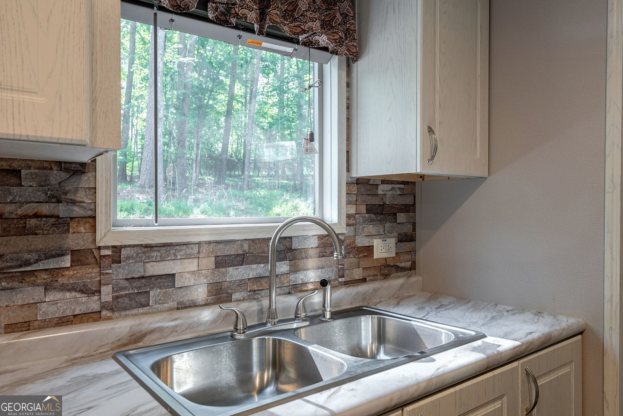 128 Sunfish Trail Southwest Eatonton, GA 31024 - Photo 18 of 48 a close view of sink and tap