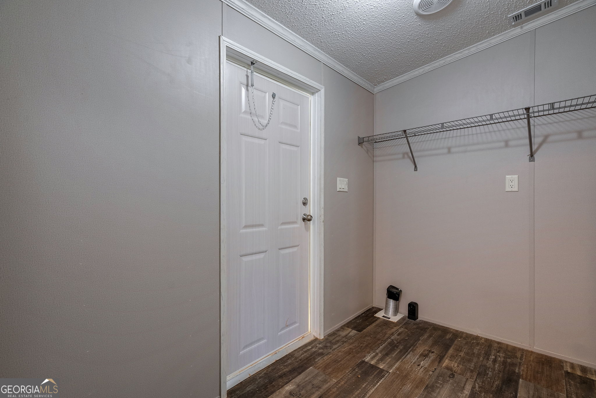 128 Sunfish Trail Southwest Eatonton, GA 31024 - Photo 20 of 48 a view of a room with wooden floor and closet