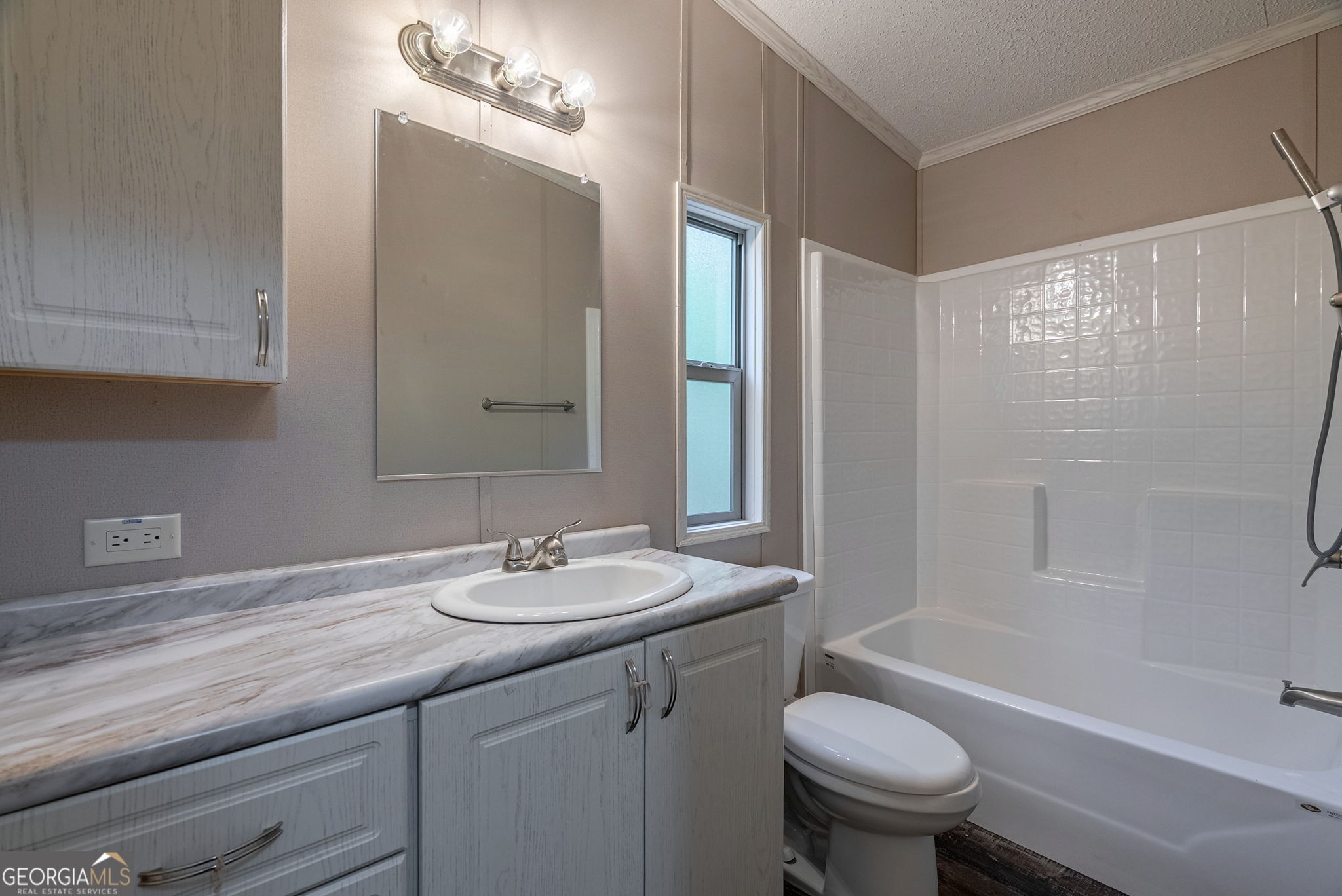 128 Sunfish Trail Southwest Eatonton, GA 31024 - Photo 33 of 48 a bathroom with a sink toilet and shower