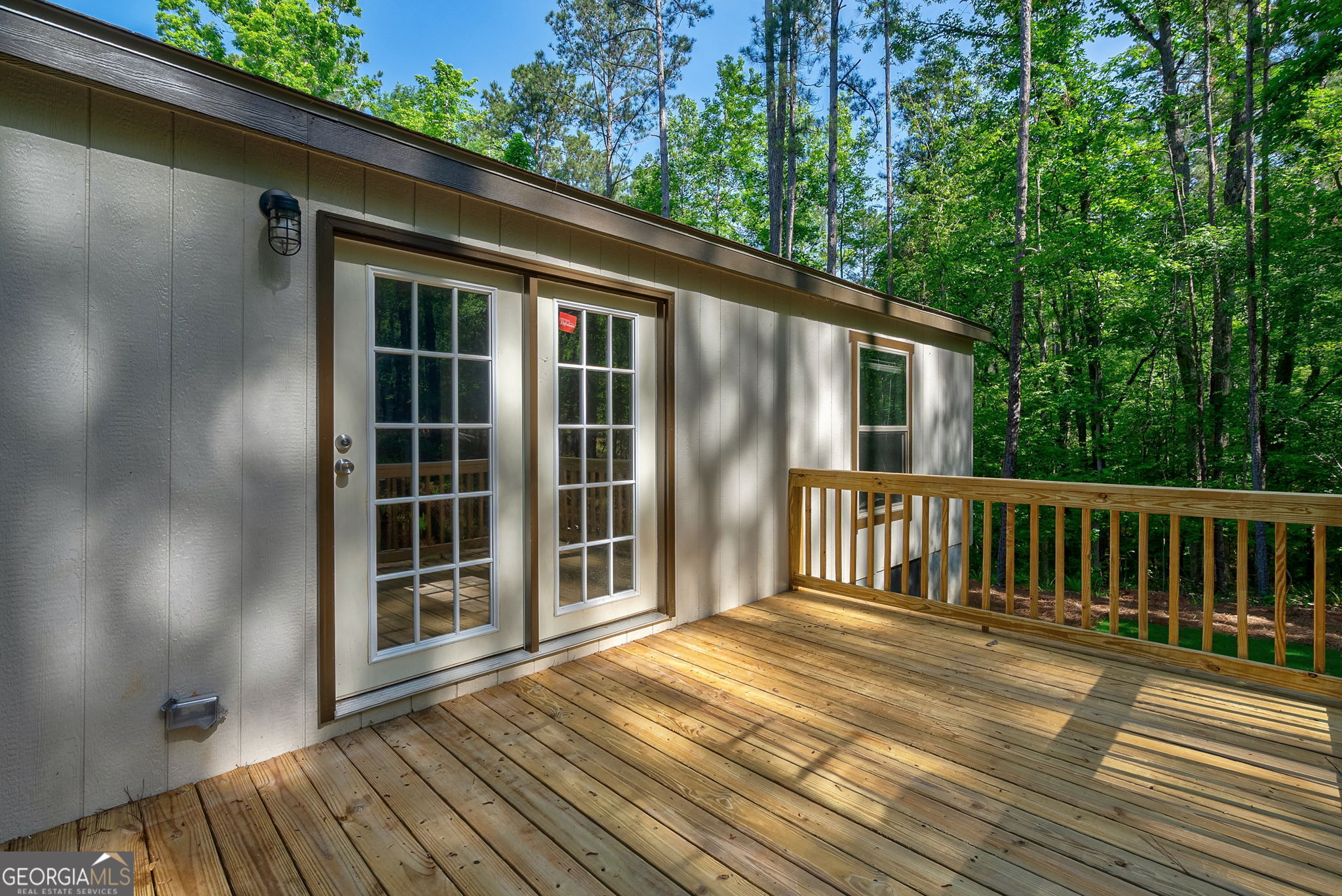 128 Sunfish Trail Southwest Eatonton, GA 31024 - Photo 36 of 48 a view of backyard with large trees and wooden floor