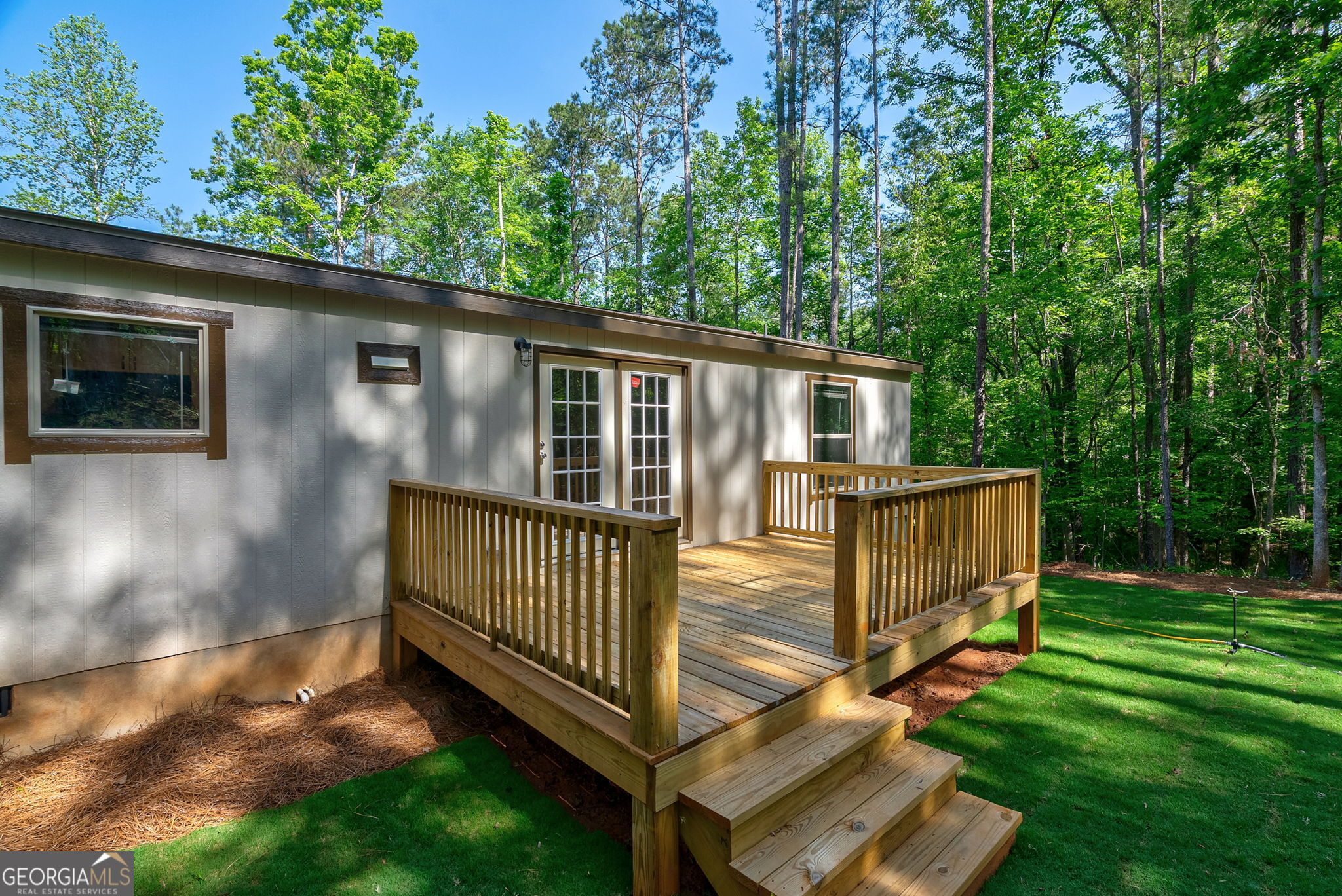 128 Sunfish Trail Southwest Eatonton, GA 31024 - Photo 38 of 48 a view of backyard with deck and garden