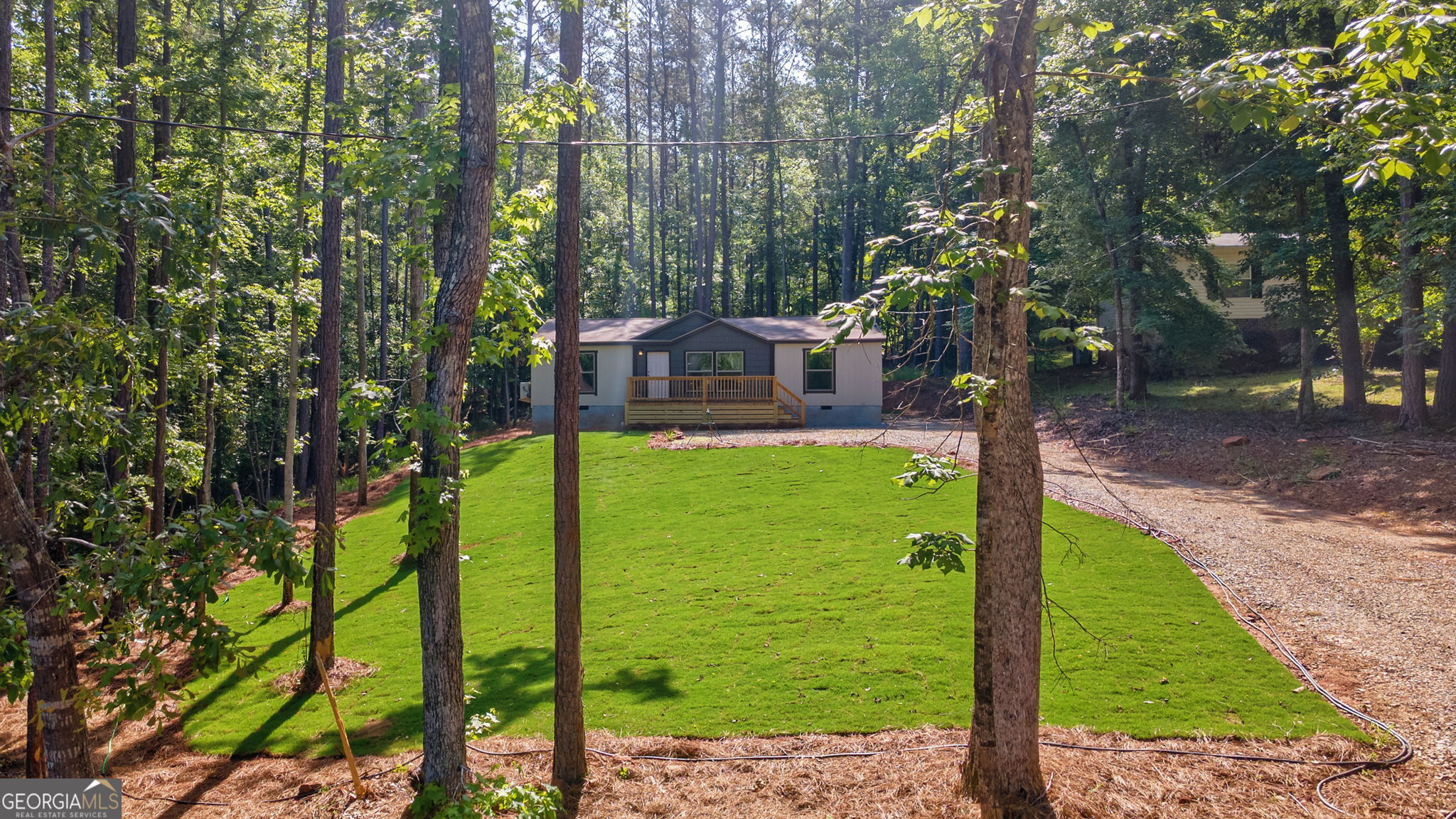 128 Sunfish Trail Southwest Eatonton, GA 31024 - Photo 43 of 48 a view of a patio with a tree