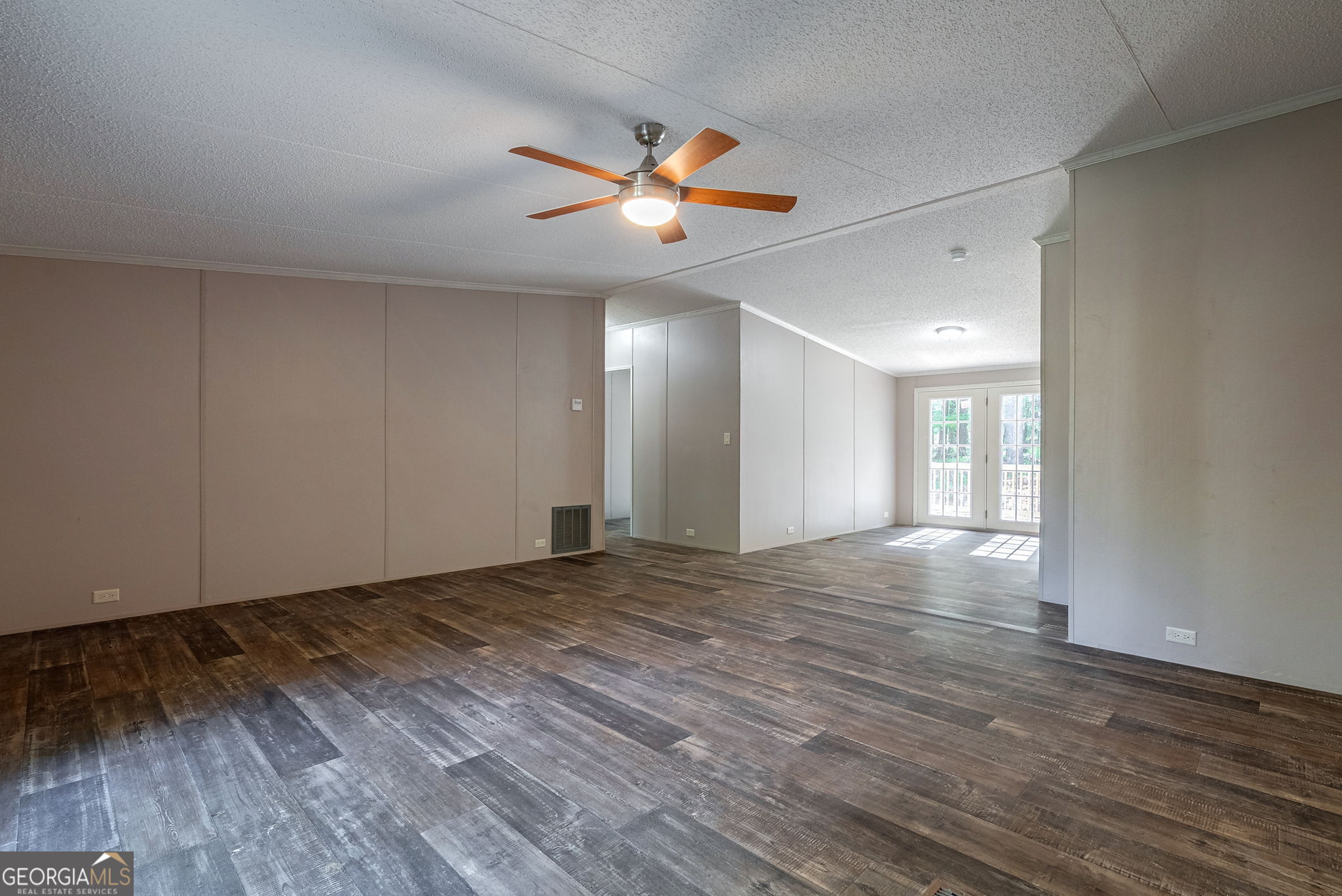 128 Sunfish Trail Southwest Eatonton, GA 31024 - Photo 7 of 48 a view of an empty room and window wooden floor