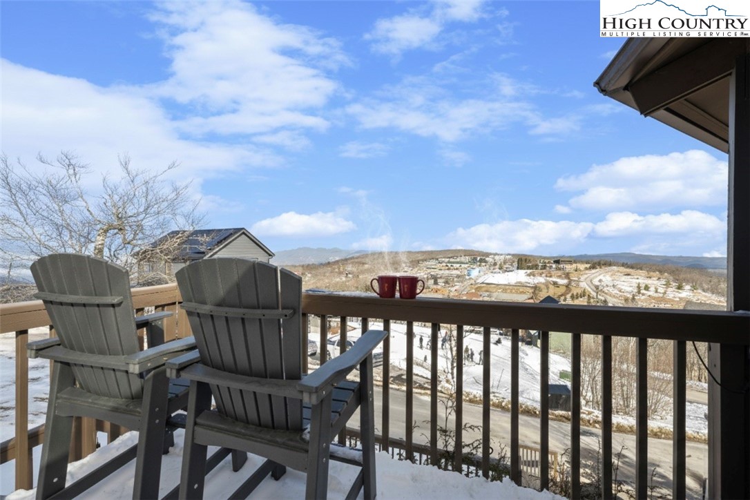 109 Skiloft Road Beech Mountain, NC 28604 - Photo 7 of 30 a view of a chair and table in the balcony