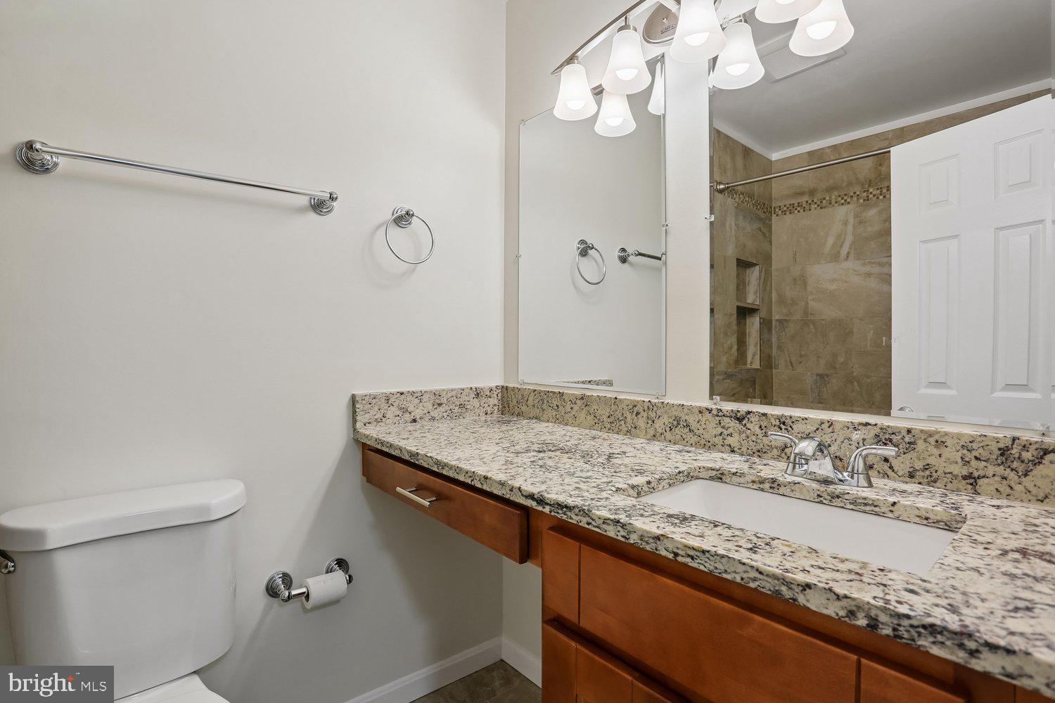10804 Douglas Avenue Silver Spring, MD 20902 - Photo 32 of 46 Updated hall bath with granite countertops