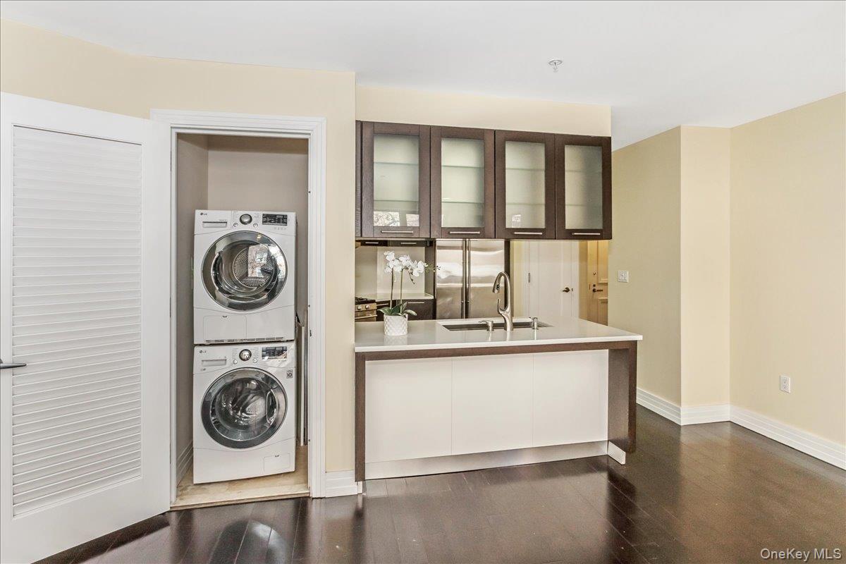 64-05 Yellowstone Boulevard, Unit 207 Queens, NY 11375 - Photo 11 of 18 a utility room with dryer and washer