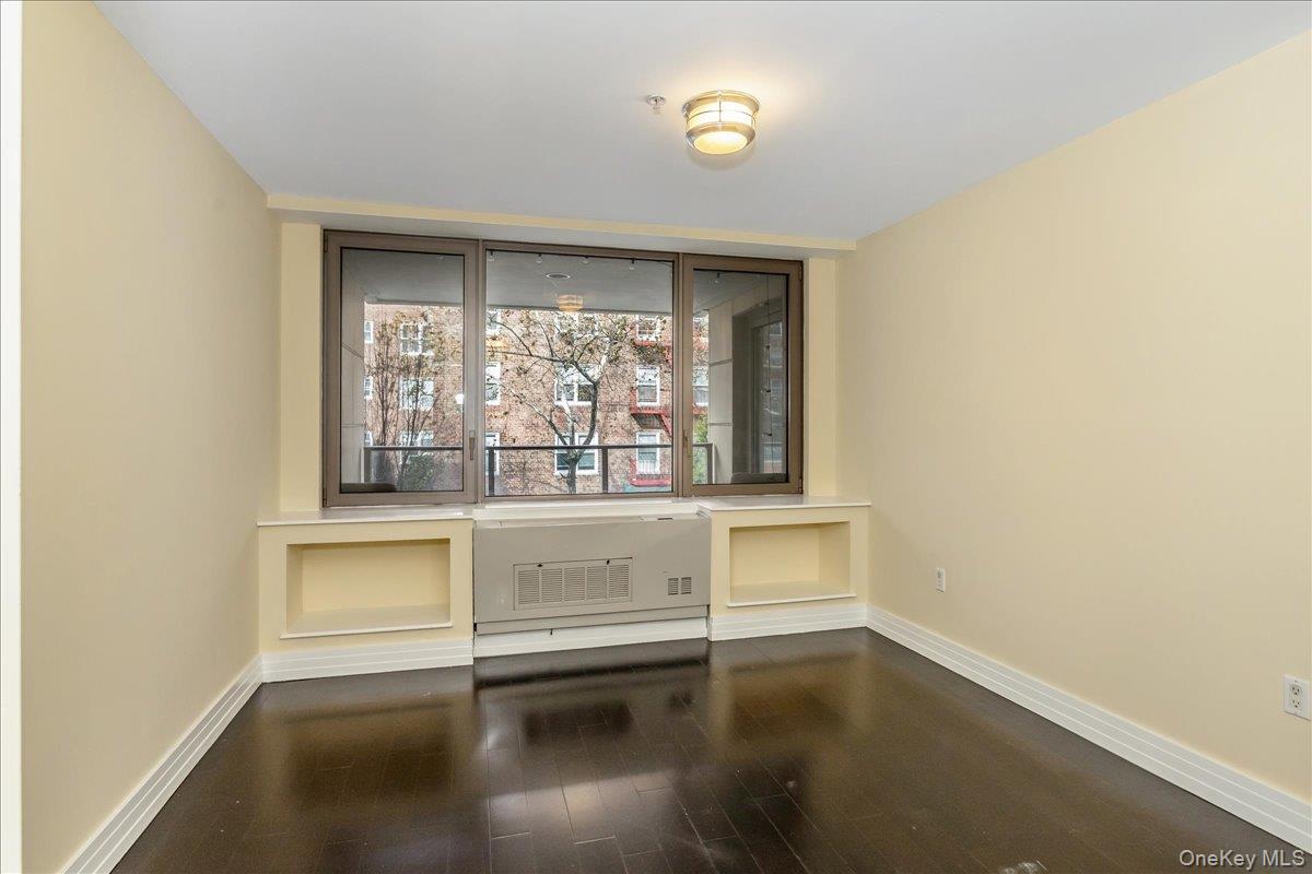 64-05 Yellowstone Boulevard, Unit 207 Queens, NY 11375 - Photo 15 of 18 an empty room with a window