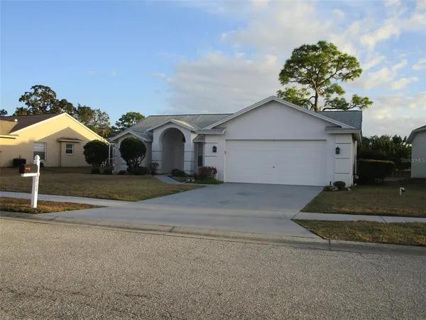 a view of garage and a yard